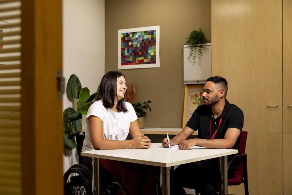 Occupational Therapist completing a Functional Capacity Assessment with an adult participant