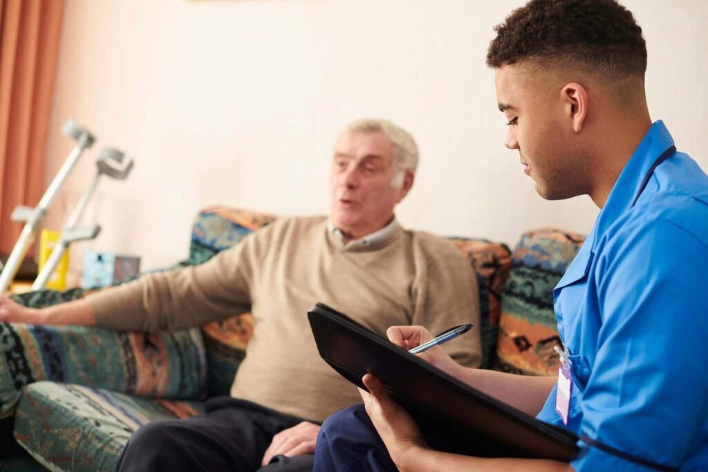 Occupational Therapist discussing daily living goals with an adult NDIS participant