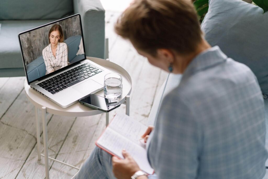 Adult participating in an online telehealth psychology appointment