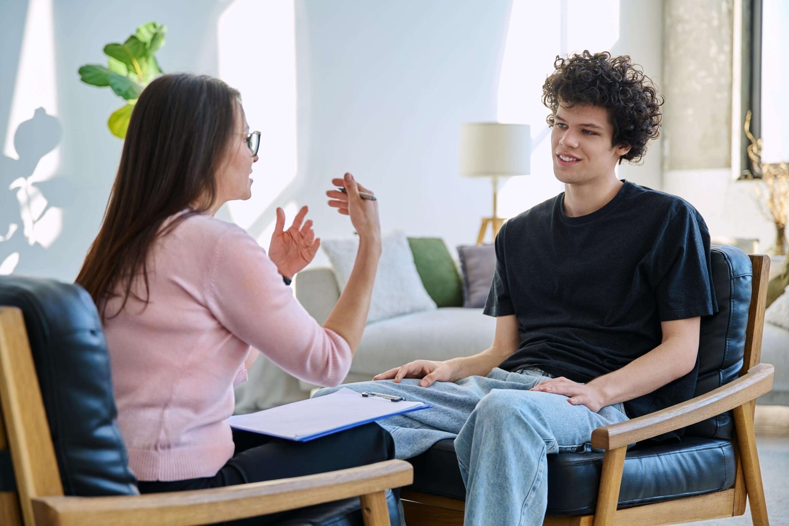 Psychologist supporting an autistic adult during a therapy session