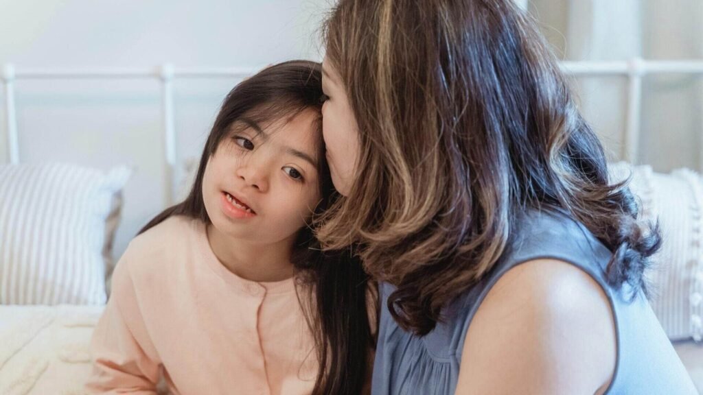 Parent supporting a child with Autism alongside a psychologist