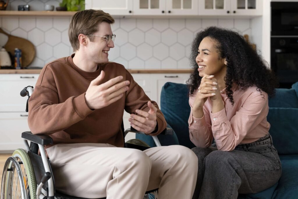 Positive Behaviour Support Practitioner Positive behaviour support practitioner discussing an individualised plan with carers